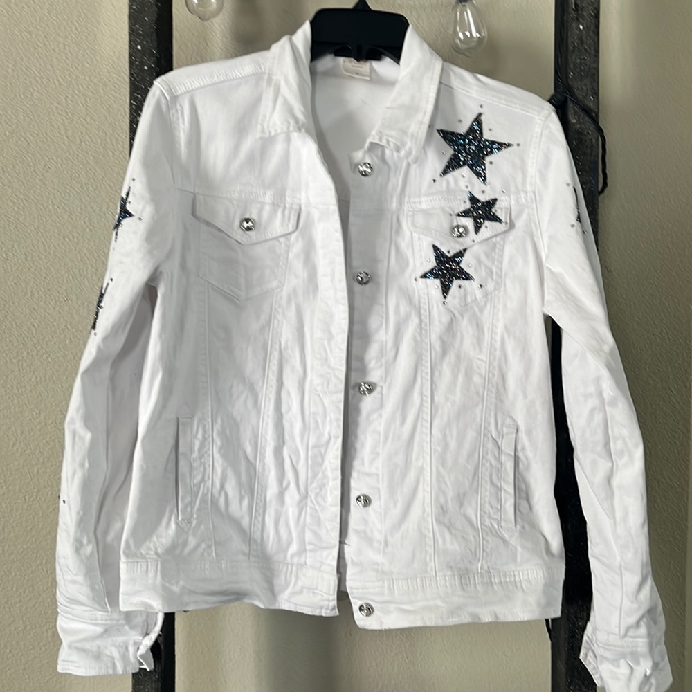 White blue Jean jacket w/dazzling stars. Stars in front, down arms & on back.